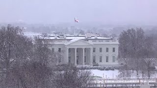 Watch a view of the White House as snow falls in DC [upl. by Enyleve]