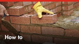 How to Build a BRICK GARDEN WALL from Start to Finish [upl. by Elleahcim]